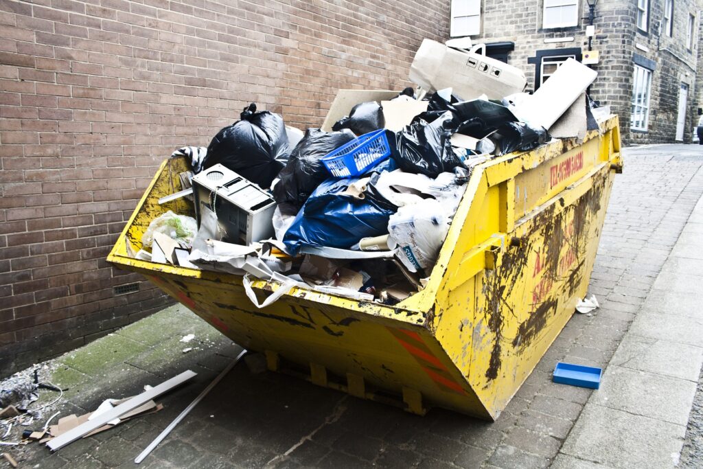 overloaded concrete with dumpster