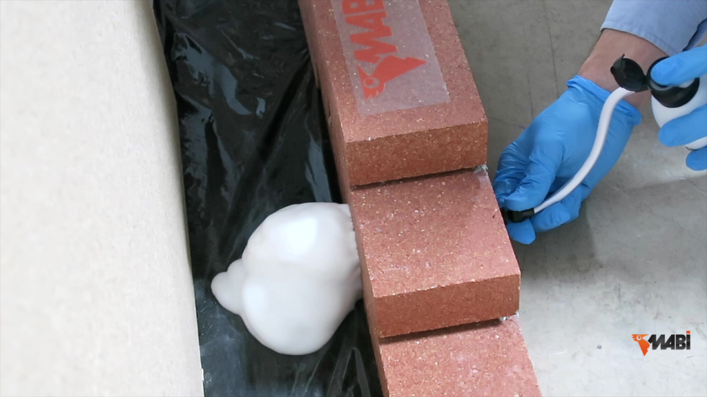 foam injection treatment behind brick veneer